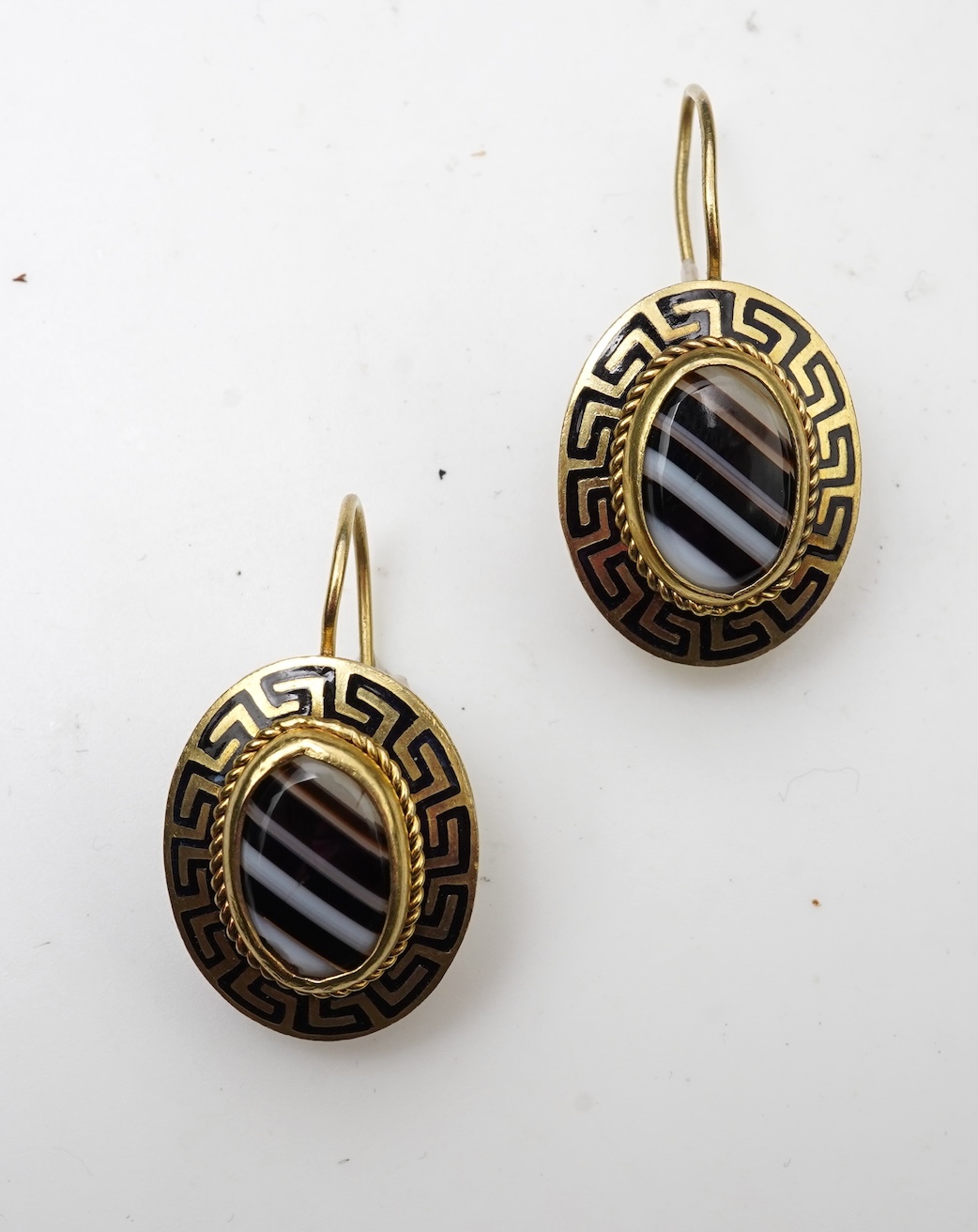 An enamel and onyx demi-parure, late 19th century